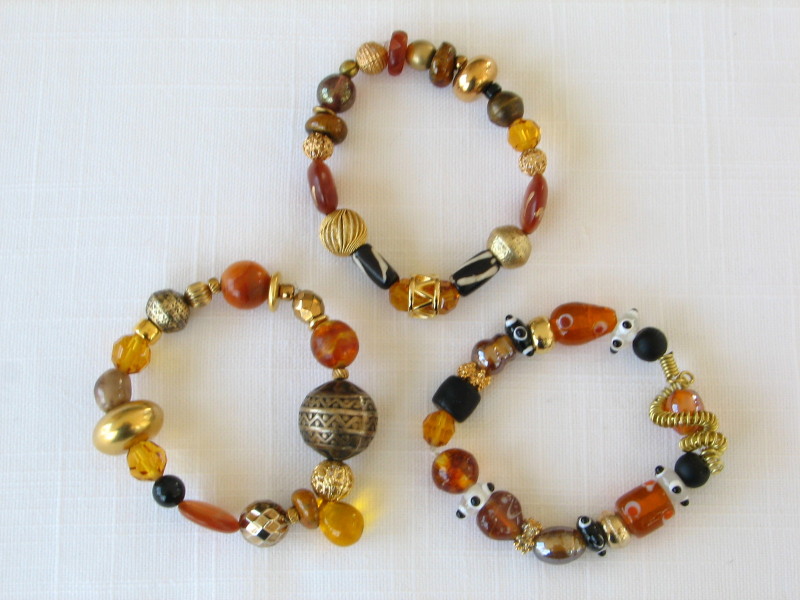 One of a Kind bracelets in topaz, brown black, gold and silver