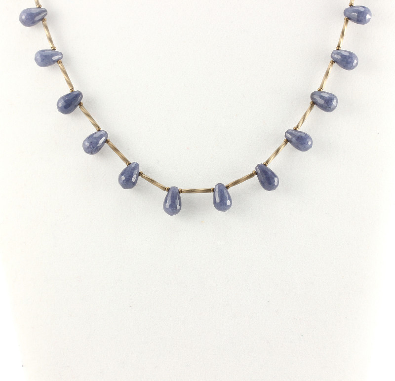A delicate necklace of blue jade briolettes and Miyuki bronze tubes
