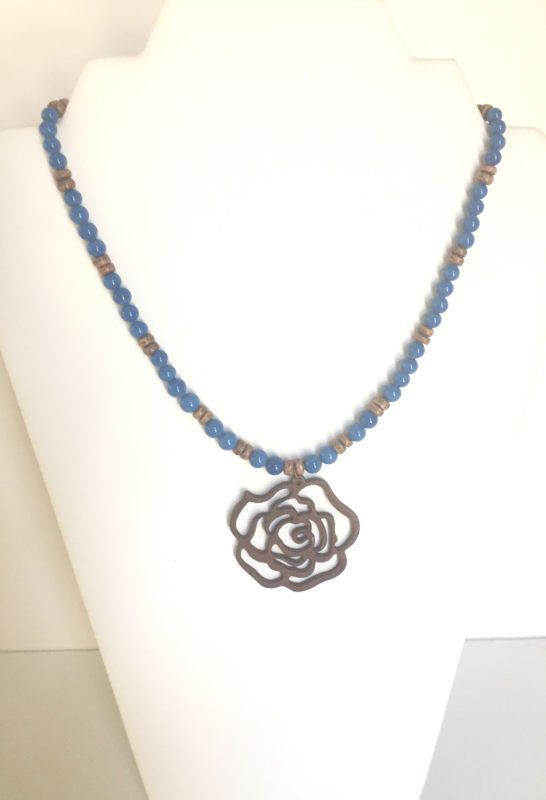 Brown wooden flower on teal chain